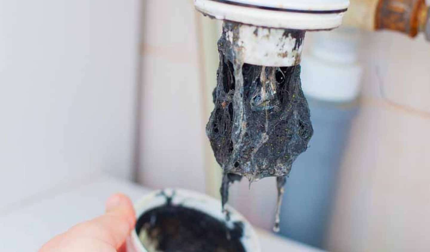 Close up of clogged sink pipe